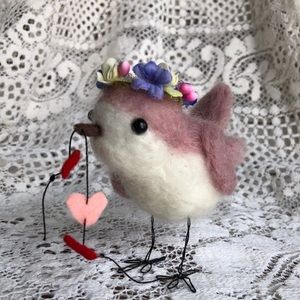 Needle Felted handmade songbird with string of hearts